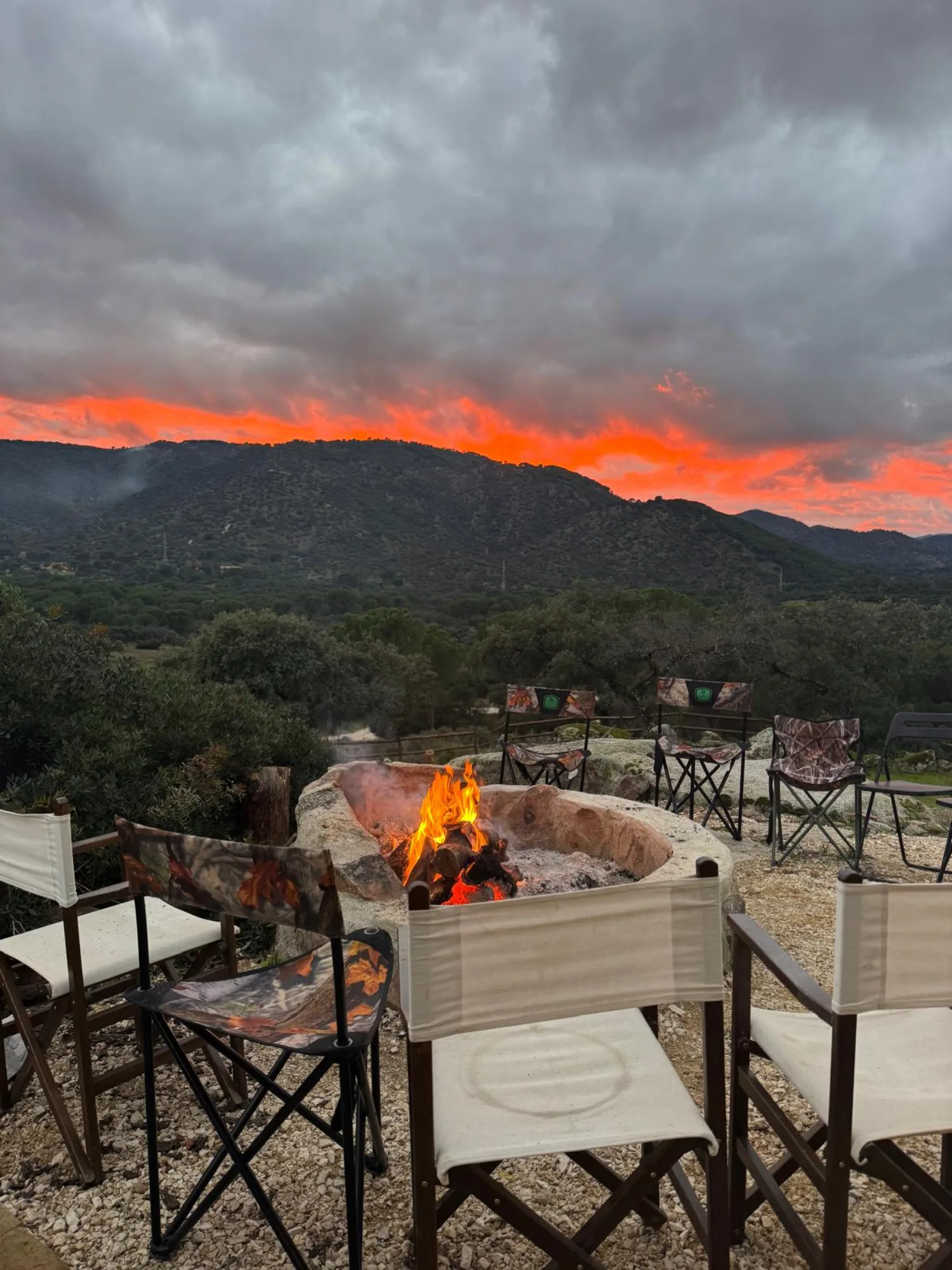 The boma fire pit at sunset, beneath open skies