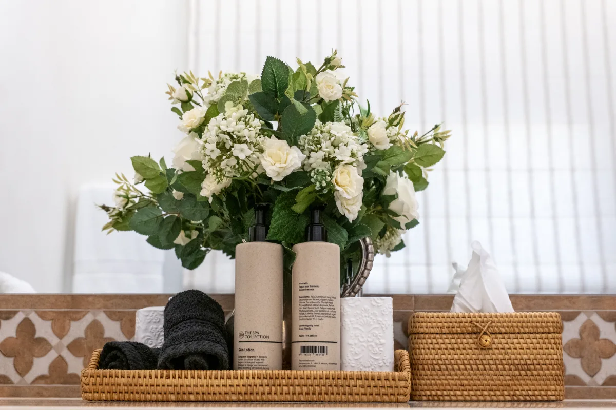 Fresh flowers and linens in a lodge bathroom