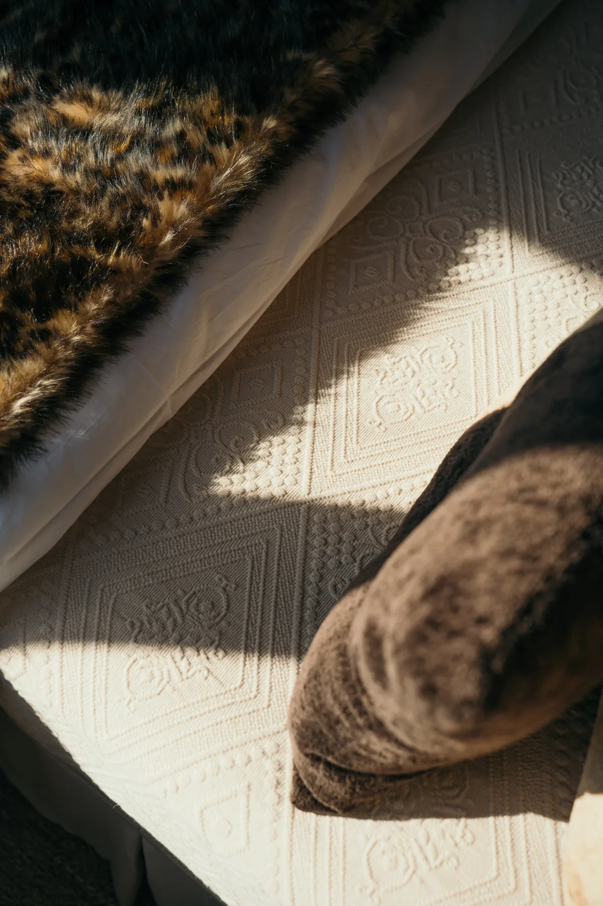 Detail of a fur throw in a lodge bedroom